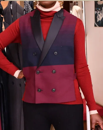 Close up of fabric and design of half bare maroon vest jacket