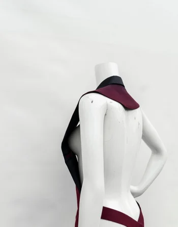 Model wearing half bare maroon vest jacket