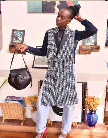 Back view of long bare back herringbone pattern vest jacket